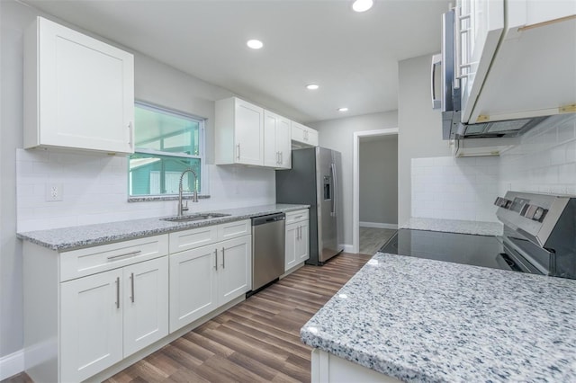 kitchen featuring sink, white cabinetry, and stainless steel appliances