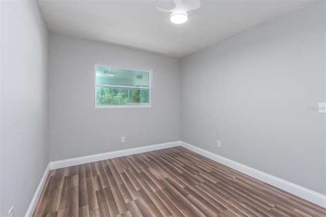 empty room with dark hardwood / wood-style floors