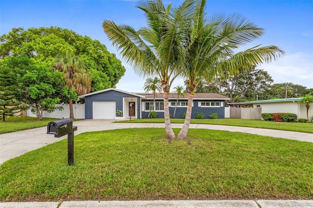 ranch-style home with a front lawn and a garage