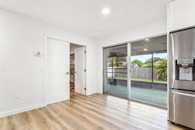 spare room with light wood-type flooring