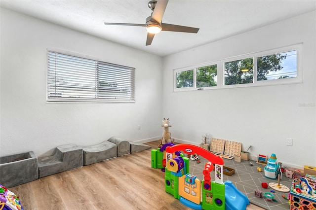 game room with ceiling fan and wood-type flooring