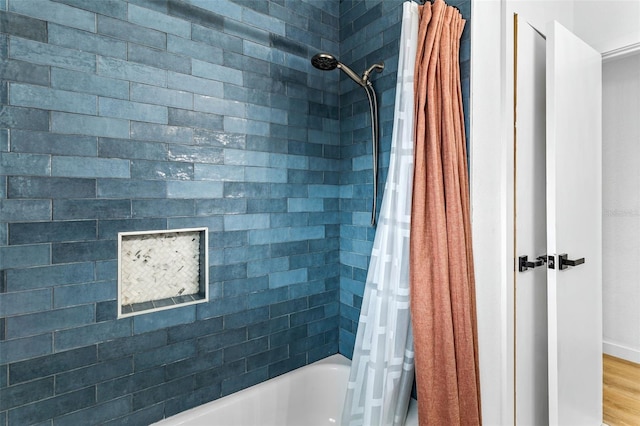 bathroom with shower / bath combo with shower curtain and hardwood / wood-style flooring