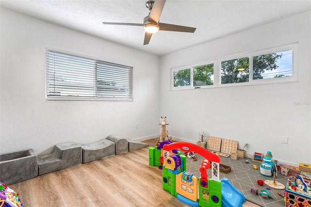 recreation room featuring hardwood / wood-style flooring and ceiling fan