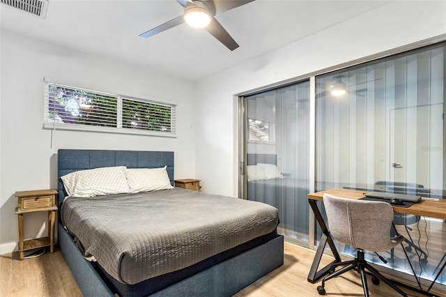 bedroom with light hardwood / wood-style floors and ceiling fan