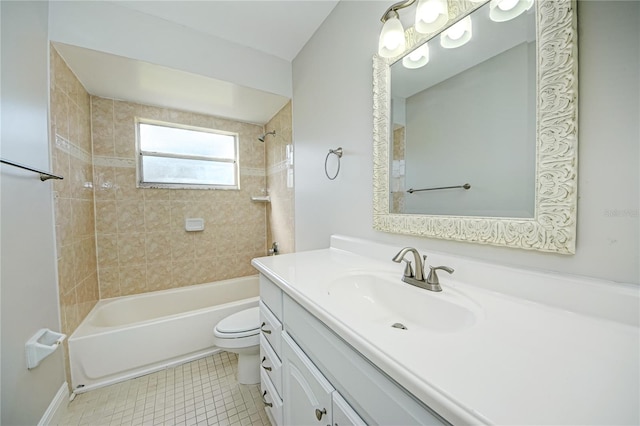 full bathroom featuring tile patterned floors, tiled shower / bath combo, toilet, and vanity