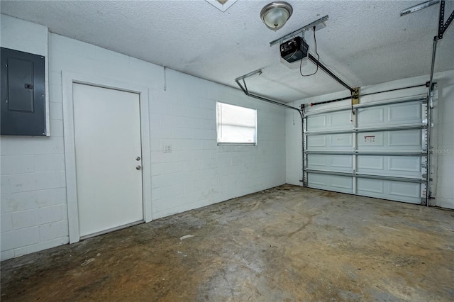 garage featuring a garage door opener and electric panel