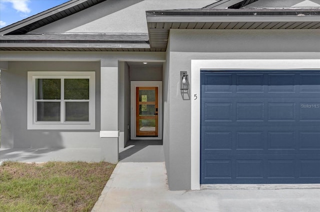 property entrance with a garage