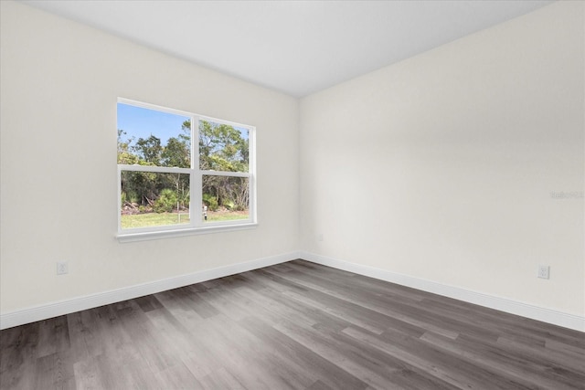 empty room featuring dark hardwood / wood-style floors