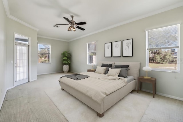 bedroom featuring light carpet, ceiling fan, and ornamental molding