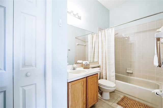 full bathroom with toilet, vanity, tile patterned floors, and shower / tub combo with curtain