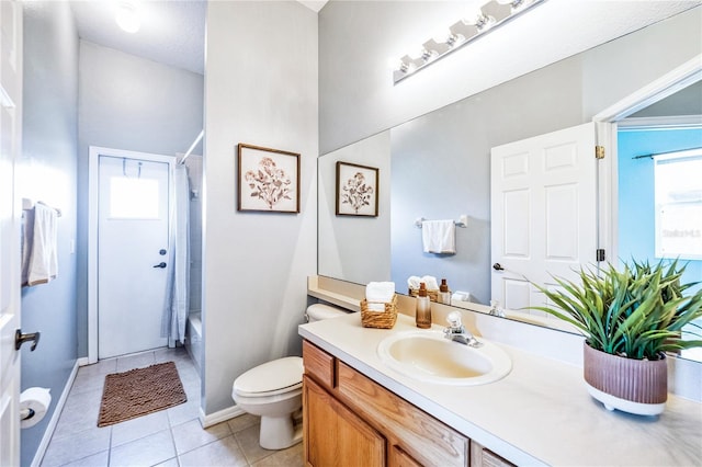 full bathroom featuring tile patterned floors, vanity, a healthy amount of sunlight, and shower / bath combo