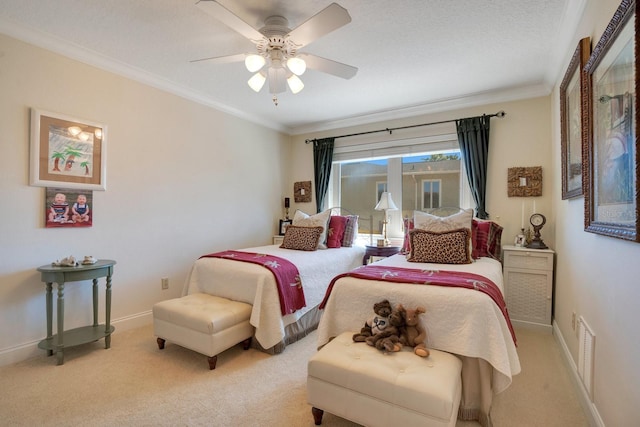 carpeted bedroom with ornamental molding and ceiling fan