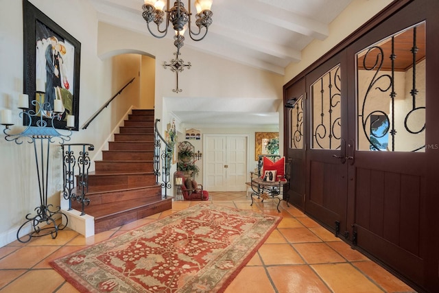 entryway featuring light tile patterned flooring and vaulted ceiling with beams