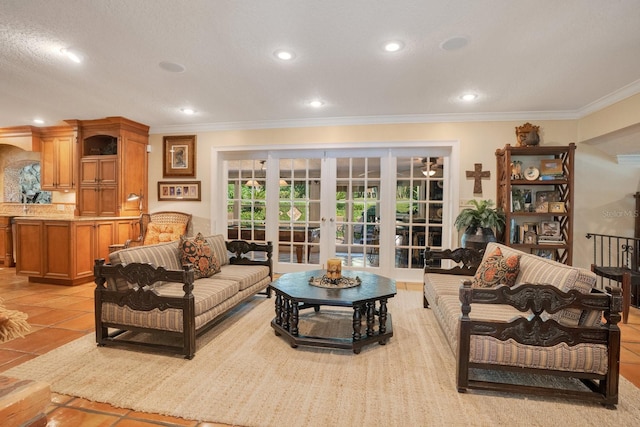 tiled living room with french doors, ornamental molding, and a textured ceiling