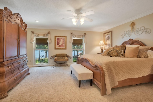 carpeted bedroom featuring crown molding, access to exterior, a textured ceiling, and ceiling fan