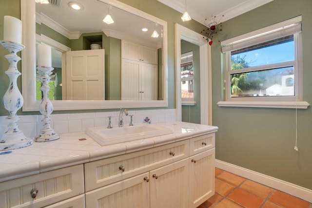 bathroom featuring vanity, crown molding, and tile patterned floors