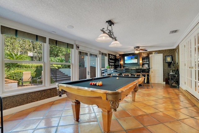 game room featuring crown molding, pool table, a textured ceiling, and ceiling fan