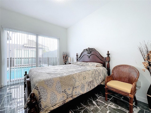 bedroom featuring lofted ceiling