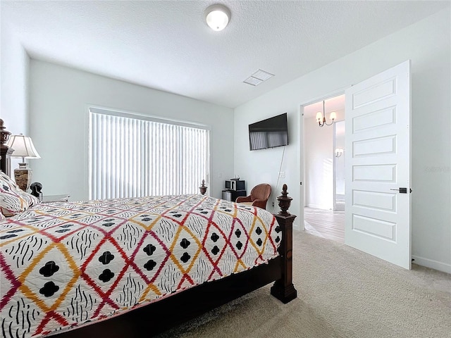 carpeted bedroom with a textured ceiling