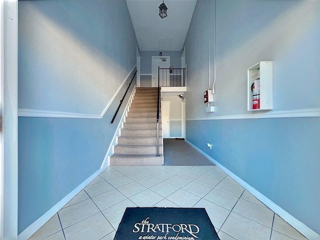 staircase with tile patterned flooring