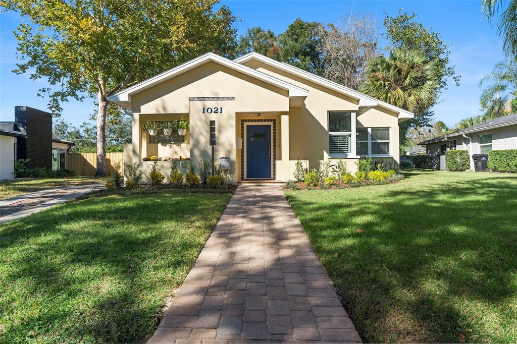 bungalow with a front lawn