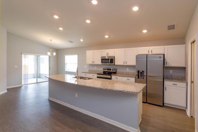 kitchen with a center island with sink, sink, white cabinetry, and stainless steel appliances