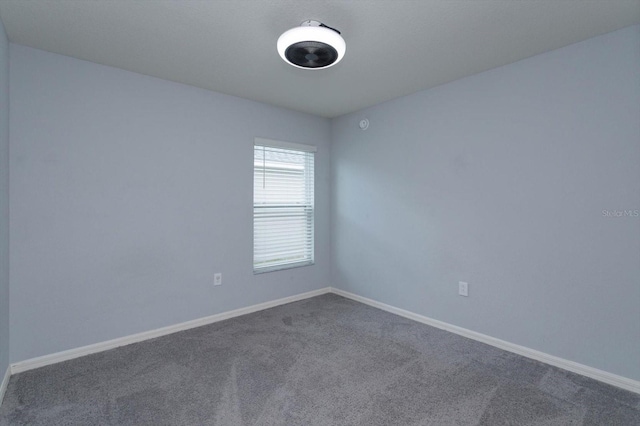 empty room with carpet flooring