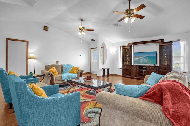 living room with vaulted ceiling, light hardwood / wood-style floors, and ceiling fan