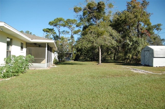 view of yard with a storage shed