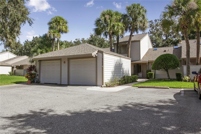 view of front of home with a shingled roof