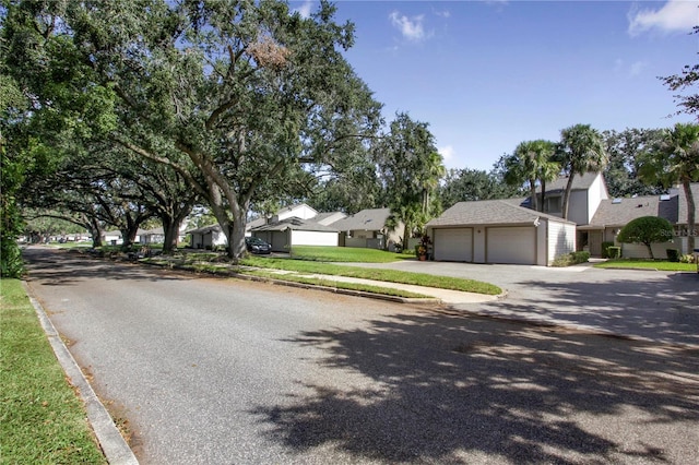 view of road with curbs and a residential view