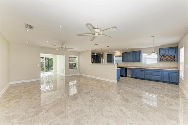 unfurnished living room with ceiling fan