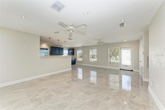 unfurnished living room with ceiling fan