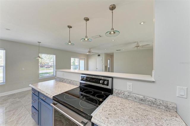 kitchen featuring blue cabinets, electric range, and pendant lighting