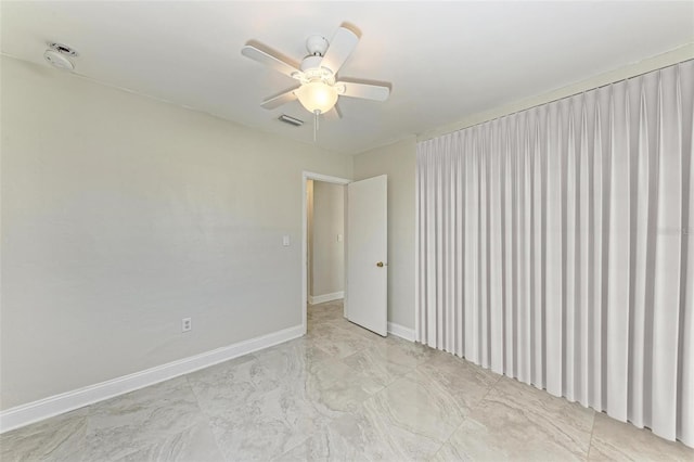 spare room featuring ceiling fan