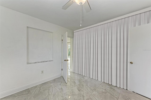 unfurnished room featuring ceiling fan