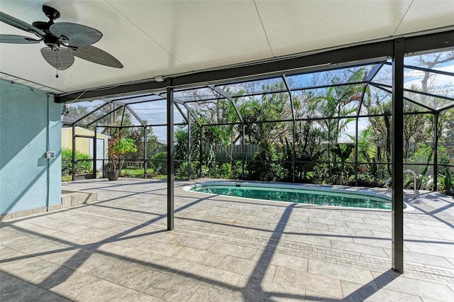 view of pool featuring a patio, a lanai, and ceiling fan