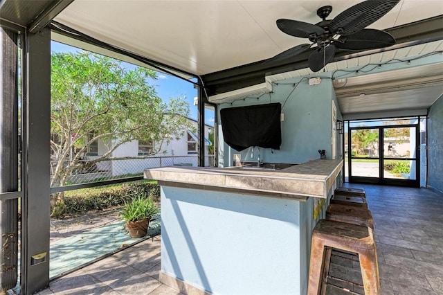 view of patio featuring ceiling fan