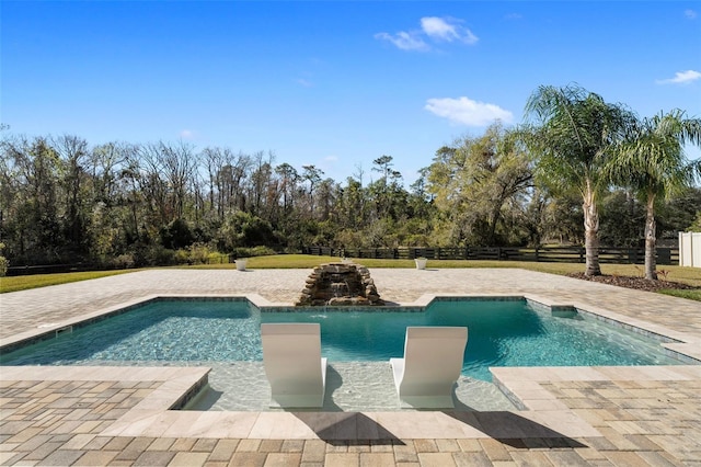 view of swimming pool featuring a patio area