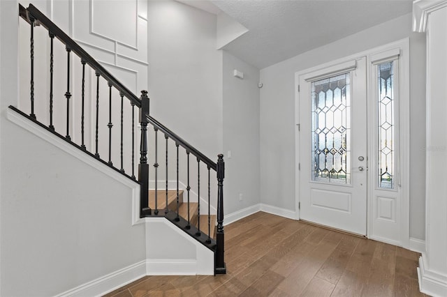 entryway featuring hardwood / wood-style flooring and a healthy amount of sunlight