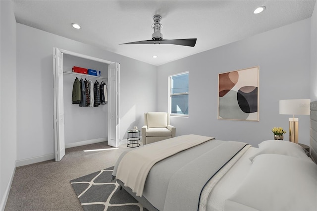 bedroom with light colored carpet, a closet, and ceiling fan