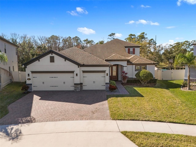 view of front facade featuring a garage and a front yard