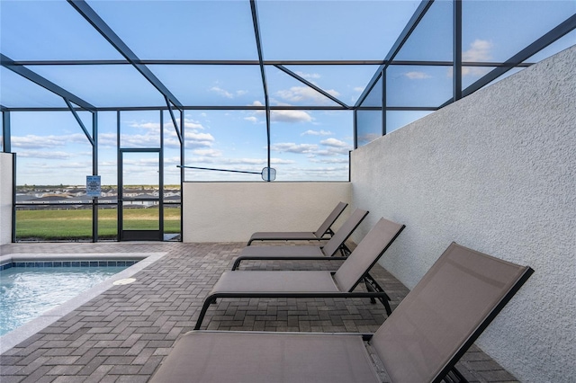 view of pool featuring a patio and a lanai