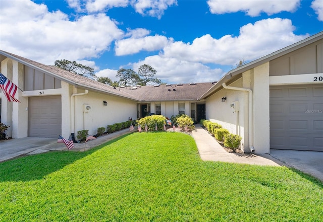 single story home with a front yard and a garage