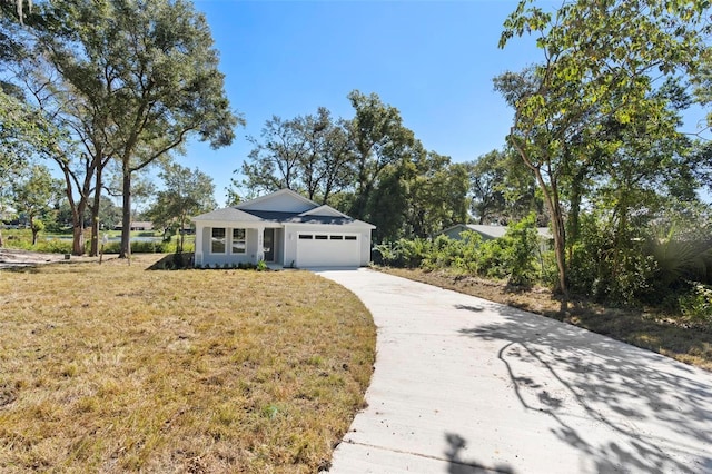 4190 Rossmore Dr, Orlando, FL 32810 - ranch-style house with an attached garage, concrete driveway, and a front lawn