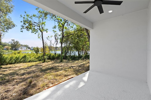 exterior space featuring a water view and ceiling fan