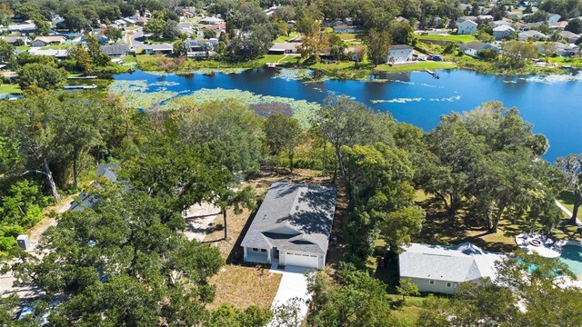 4190 Rossmore Dr, Orlando, FL 32810 - aerial perspective of suburban area featuring a nearby body of water and a tree filled landscape