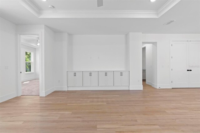 4190 Rossmore Dr, Orlando, FL 32810 - empty room with a raised ceiling, ceiling fan, light wood-style floors, ornamental molding, and baseboards