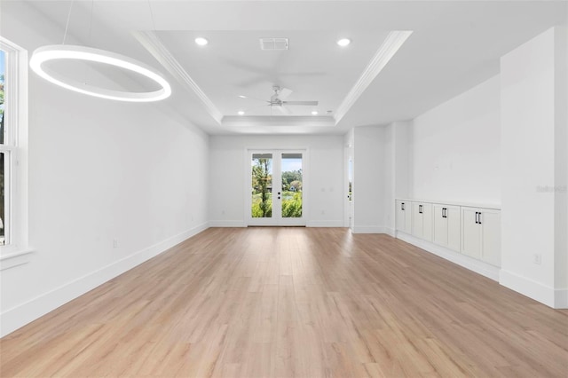 4190 Rossmore Dr, Orlando, FL 32810 - spare room featuring a raised ceiling, recessed lighting, ornamental molding, light wood-type flooring, and a ceiling fan
