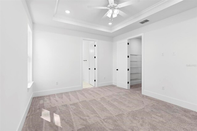 4190 Rossmore Dr, Orlando, FL 32810 - unfurnished bedroom featuring carpet, crown molding, recessed lighting, a raised ceiling, and baseboards
